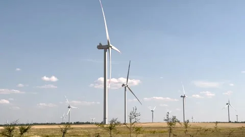 Windmills generator electricity on field. Renewable wind energy concept. Scenic Stock Footage 315890889