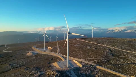 Windmills on the hills during sunset. Renewable energy, green energy Stock Footage 231795461