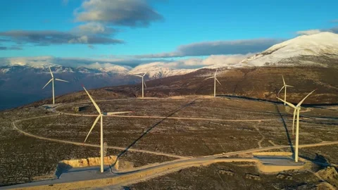 Windmills on the hills during sunset. Renewable energy, green energy. Stock Footage 233027265