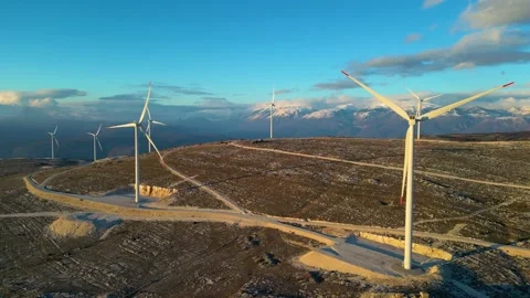 Windmills on the hills during sunset. Renewable energy, green energy Stock Footage 240112737