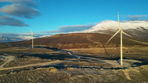 Windmills on the hills during sunset. Renewable energy, green energy Stock Footage 240187412