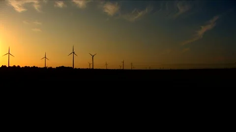 Windmills on the horizon during sunset Stock Footage 5700926