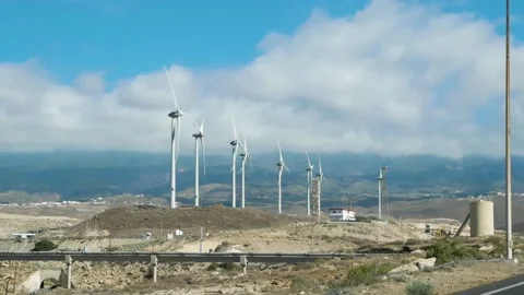 Windmills on an island in the ocean. 스톡 동영상 230906842
