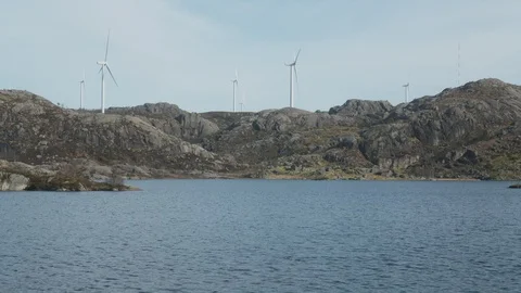 Windmills by the lake Stock Footage 127928885