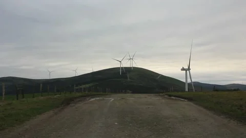 Windmills in the mountains to generate wind energy Stock Footage 236511224