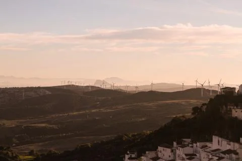 Windmills in the mountains at sunset Stock Photos