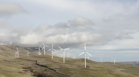 Windmills on Mountainside pan Stock Footage 32495821
