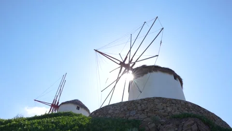 Windmills in Mykonos, Greece Low Angle Move to Reveal Sunflare. Greek Islan.. Stock Footage 336512039