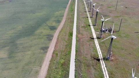 Windmills near the empty road Stock Footage 111078266