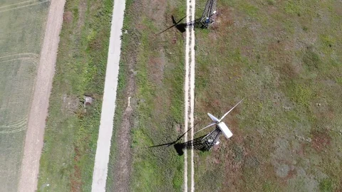 Windmills near the empty road Stock Footage 111078322