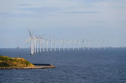 Windmills on an ocean coast Stockfoto's