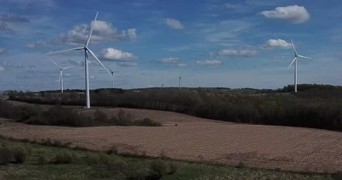 Windmills Pan Forwards with Rise Stock Footage 109075191