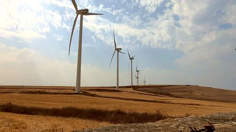 Windmills producing renewable electricity. Green energy concept Stock Footage 169452947