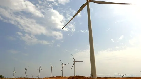 Windmills producing renewable electricity. Green energy concept Stock Footage 169452960