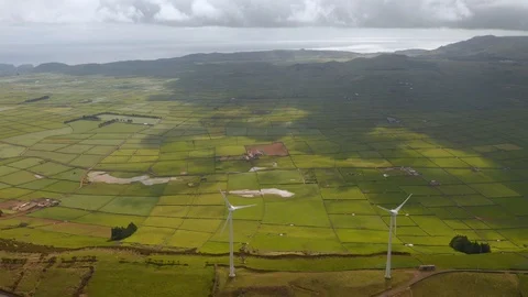 Windmills on the ridge above Serra Do Cume valley. Alternative energy sources on Stock Footage 118017352