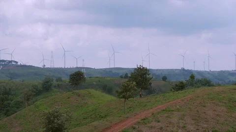 Windmills rotating by the force of the wind and generating Stock Footage 117601055