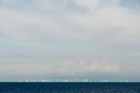 Windmills on the sea Stock Photos