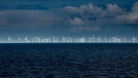 Windmills on the sea Stock Photos