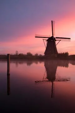 Windmills at sunset Stock Photos