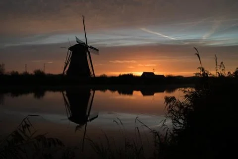 Windmills at sunset Stock-Fotos