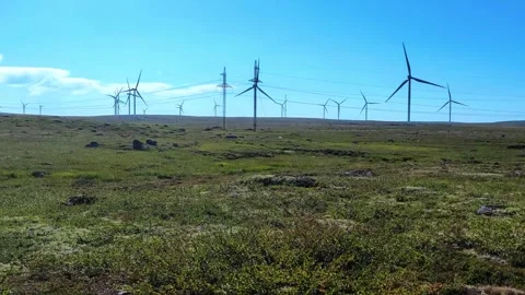 Windmills turbine rotating by wind and generating renewable green energy. Stock Footage 294680194