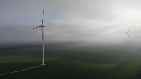 Windmills valley clouds sun rays drone green energy electric plant Stock Footage 124357161