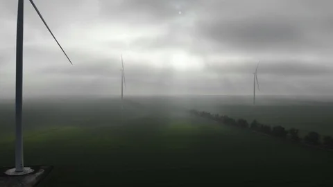 Windmills valley clouds sun rays drone green energy electric plant Stock Footage 124358006