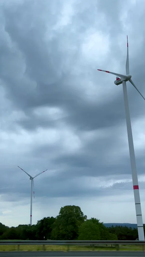 Windmills. View of wind turbines on a hill on a cloudy day near Munich Stock Footage 286239621