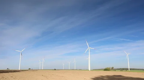 Windmills (wind farm) on field Stock Footage 58951294
