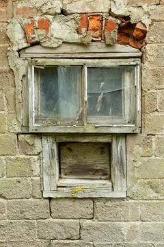 Window on a abandoned building. Stock Photos