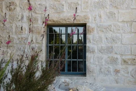 Window in a ancient stone wall Stock Photos