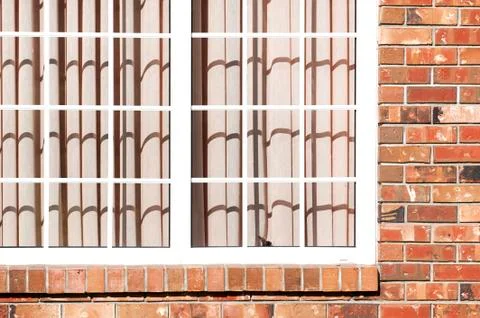Window and brick wall Stock Photos