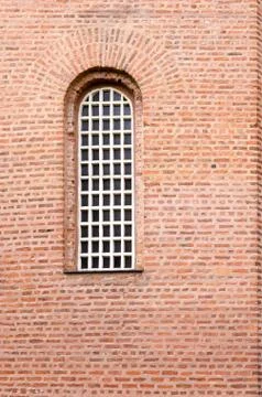 A window and a texture of a wall with red bricks Stock Photos
