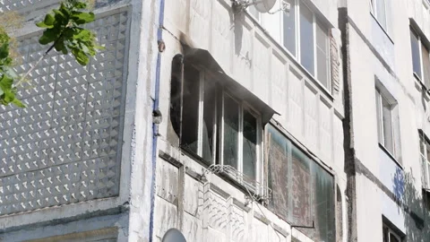 Window apartment building from which smoke comes out. Russia, Stavropol, 1.05.20 Stock Footage 145914660