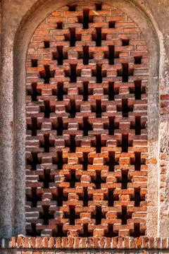 Window arch in the old brick wall Stock Photos