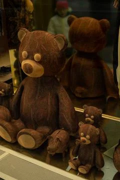 On the window are three teddy bears and a small pig piggy bank Stock Photos