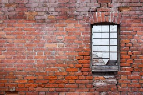 Window with bars on the background of the brick wall of the old house Stock-Fotos