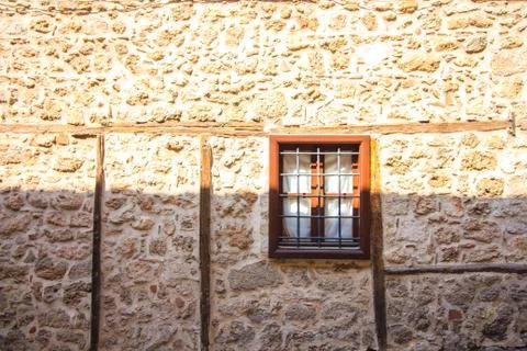 Window with bars in a stone house Stock Photos