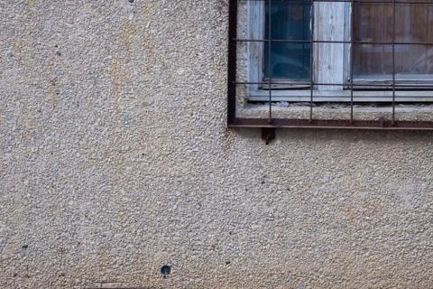 Window with bars texture surface of exposed aggregate finish Ground stone Stock Photos