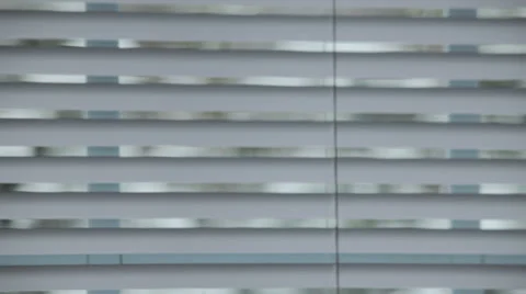 Window Blinds Open to Snowstorm Outside Stock Footage 35174170