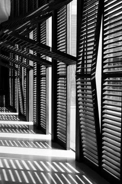Window blinds with shadows on the floor Foto stock