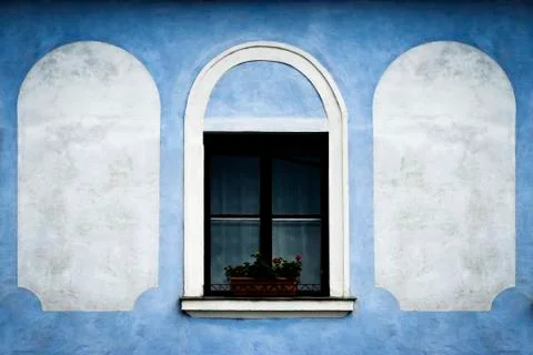 Window on the blue old wall Stock Photos
