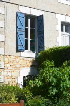 Window with blue shutters Stock Photos