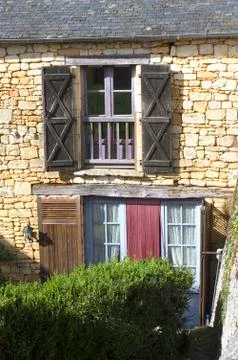 Window with blue shutters Stock Photos