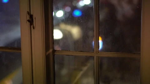 Window with blurred night city lights behind glass. Stock Footage 335522970
