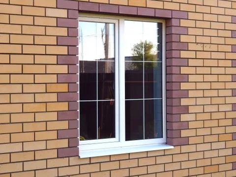 Window in a brick house Stock Photos