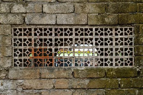 Window with a brick wall behind it Stock Photos