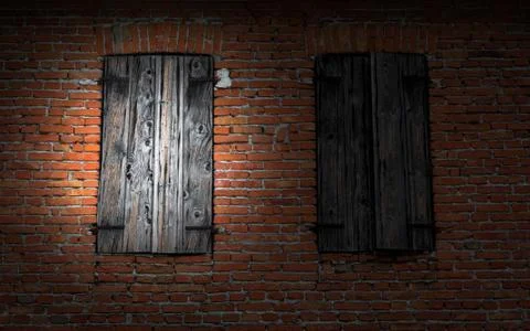 Window on brick wall illuminated by a flashlight. Stock Photos