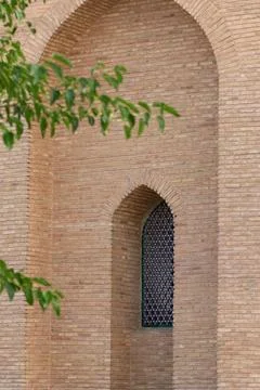 Window in the brick wall of an old historical building, central asia Stock Photos
