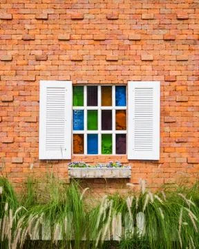 Window on brick wall Stock Photos